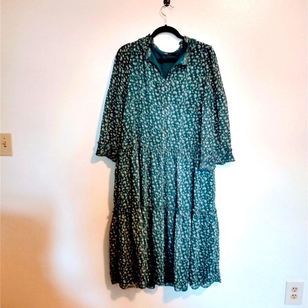 INA floral blue prairie dress with ruffle sleeves.  Size small and fits oversize